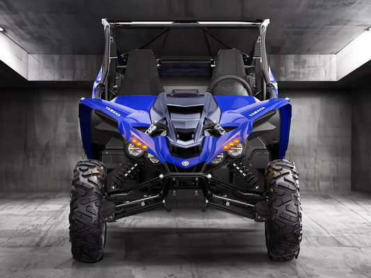 Yamaha UTV side-by-side in a garage with LED headlights.