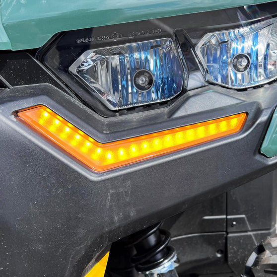 2019+ Can-Am Defender accent lights glowing amber in turn signal mode close-up view