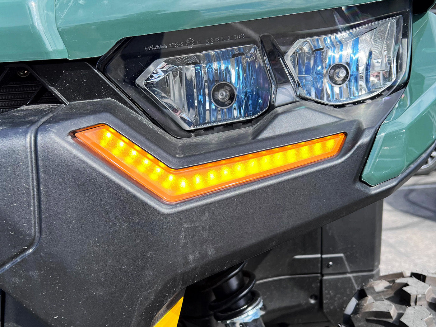 2019+ Can-Am Defender accent lights glowing amber in turn signal mode close-up view