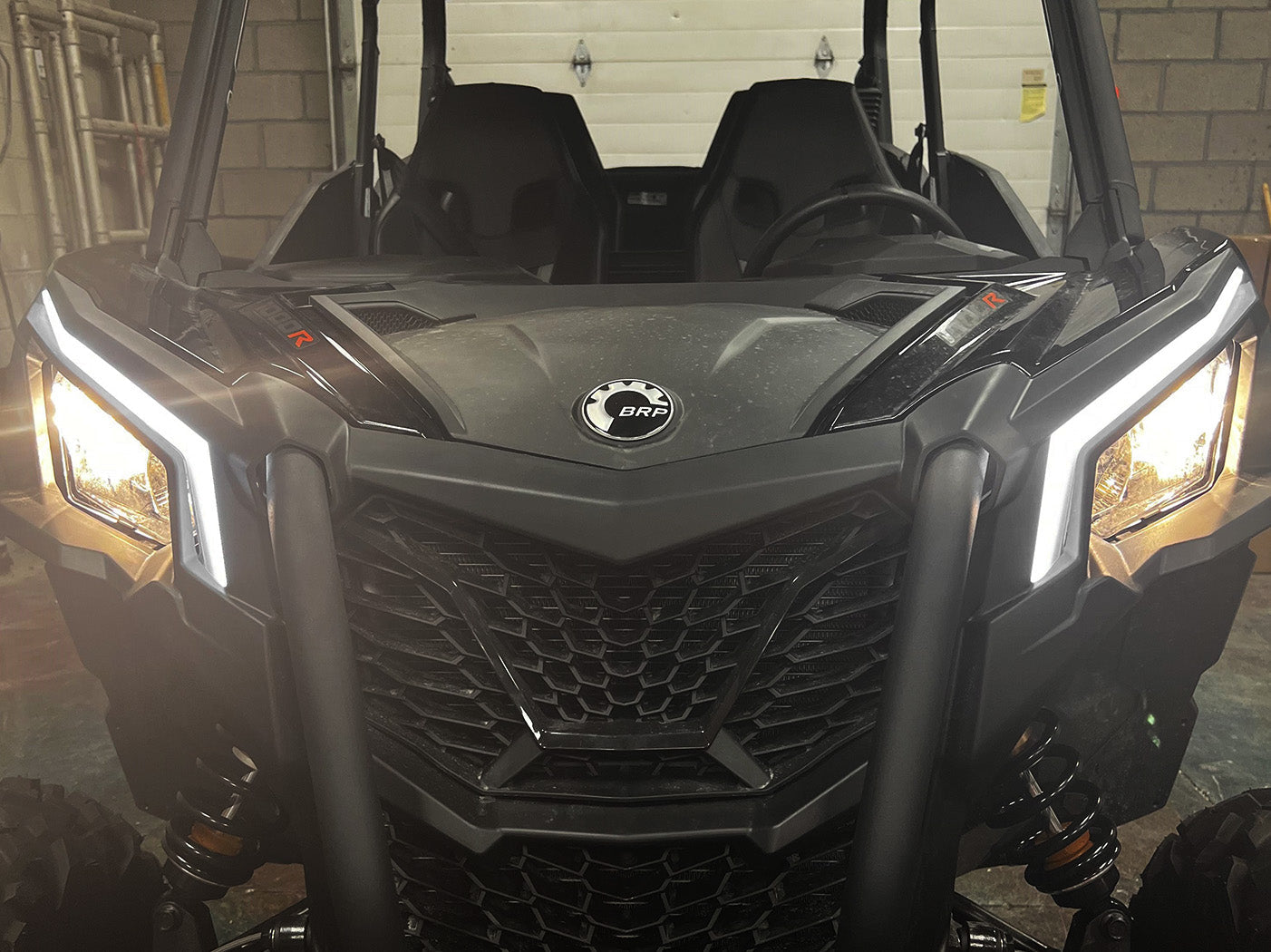 Front view of 2018+ Can Am Maverick X3 with signature replacement headlights and turn signals